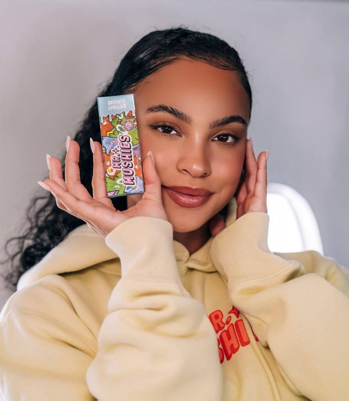 Customer holding a Mr. Mushies magic mushroom chocolate bar